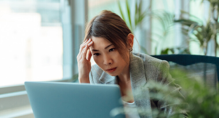 Frustrated person using computer