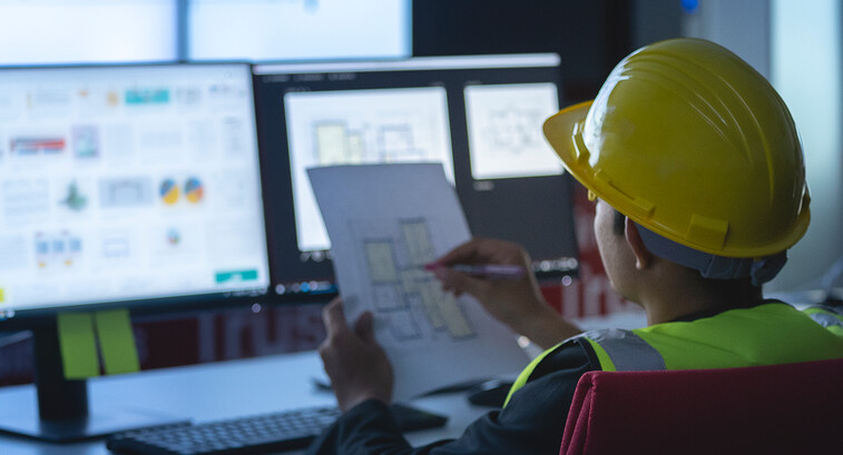 state government construction worker works at computer
