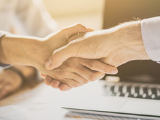 Business people shaking hands. Finishing up meeting.