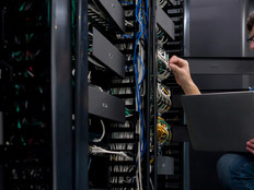 IT support technician fixing a network server