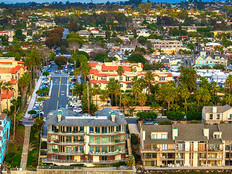 Aerial view of condos lining the beach in the northern San Diego community of Carlsbad, California.