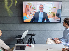 People holding a hybrid meeting