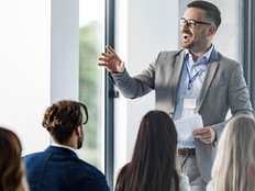 Person presenting at a conference