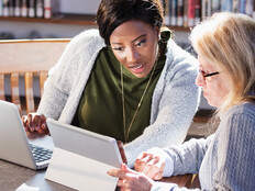 Two people collaborating across technologies