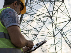 Person using tablet to assess power grid
