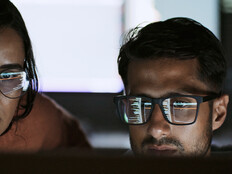 Coworkers reviewing code