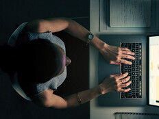 Employee using computer in a dark room