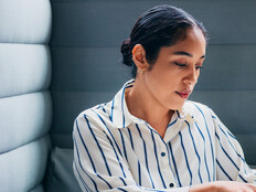 Person working on laptop in office