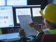 state government construction worker works at computer