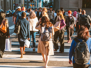 A group of people crossing the street