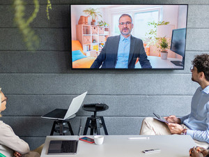 People holding a hybrid meeting