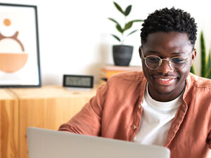 Person using laptop at home