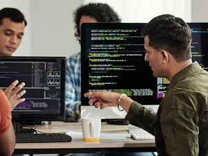 Developers Discussing Programming Code