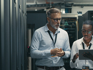 Technicians collaborating in office