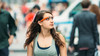 Teenage girl wearing Google Glass in Times Square