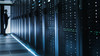 Photo of Out of Focus IT Technician Turning on Data Server.