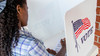 Young black woman voting 