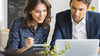 A pair of male and female executives working together 