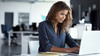 Person working on laptop in office