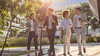 Group of business people waking outside office building