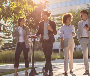 Group of business people waking outside office building