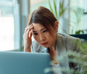 Frustrated person using computer
